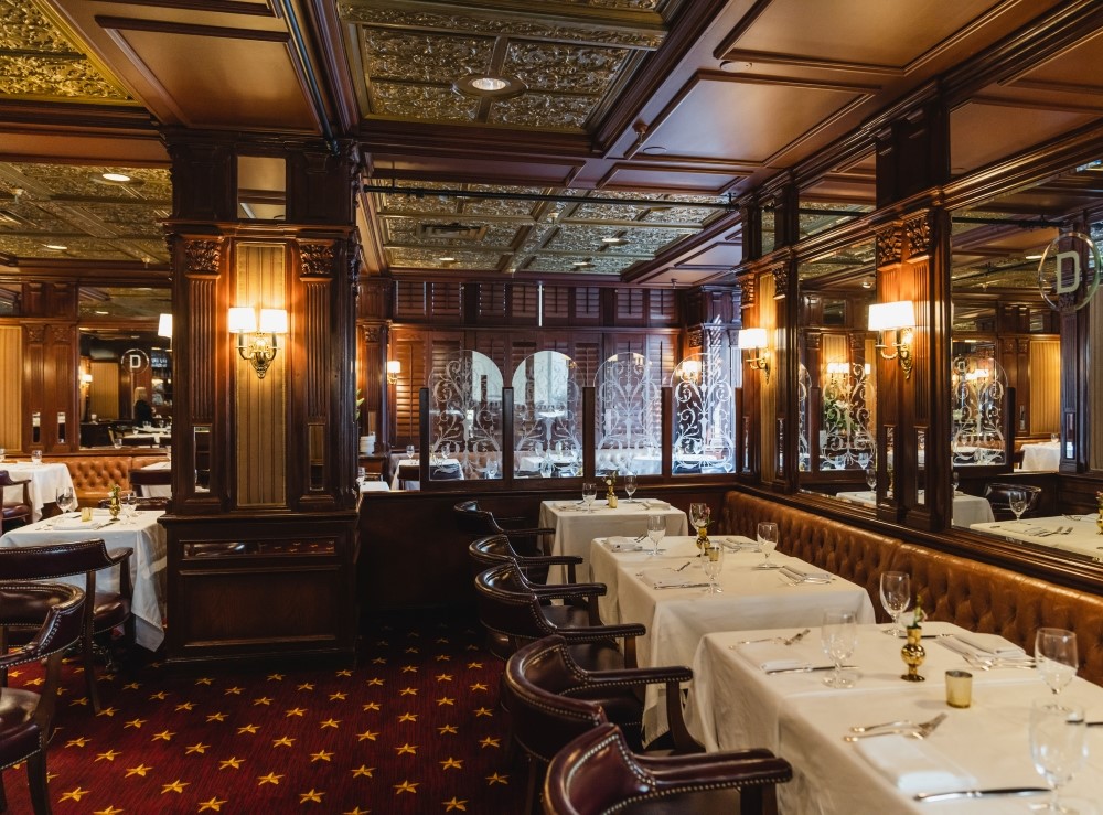 Driskell Grill restaurant interior with banquette and mirrored walls