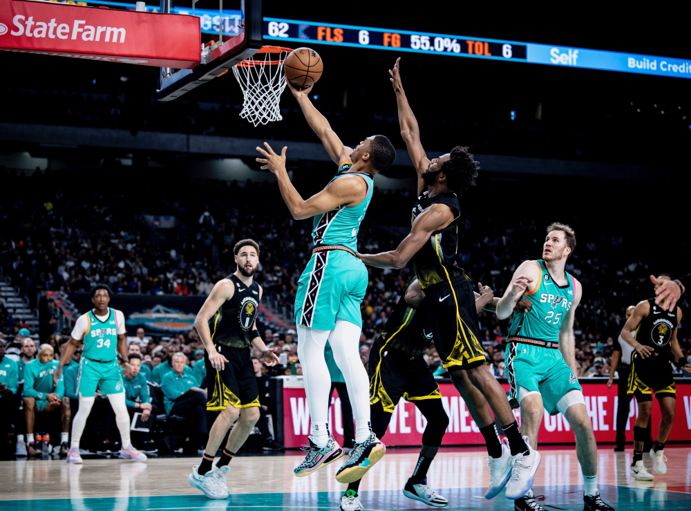 A San Antonio Spurs basketball player shoots a basket against the Golden State Warriors