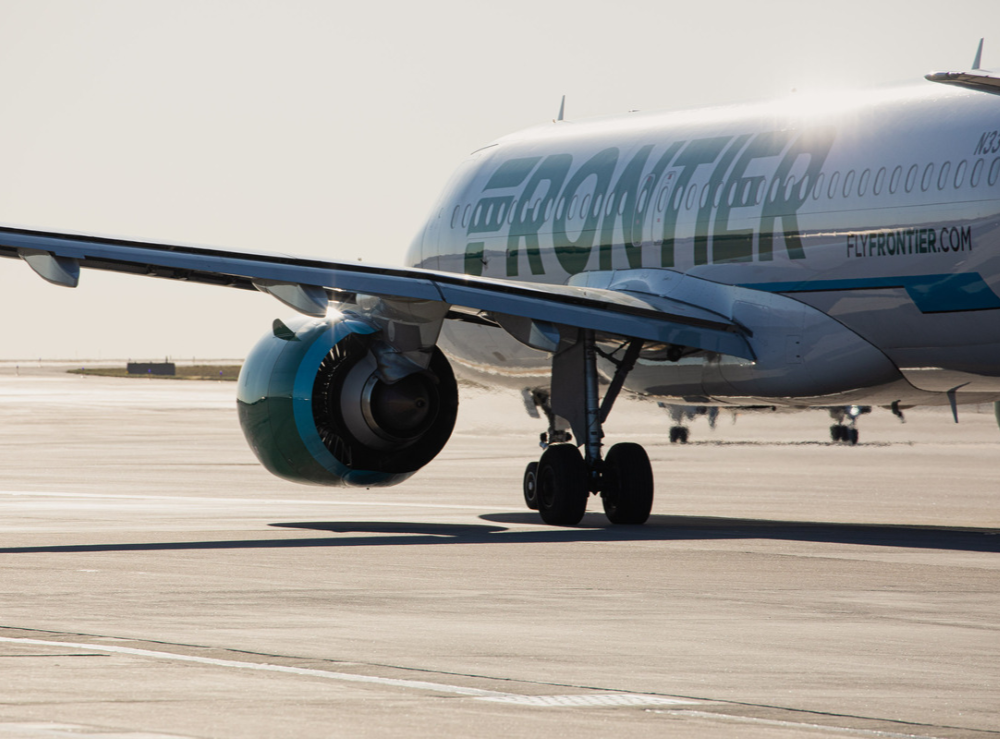 a Frontier Airlines airplane on the runway