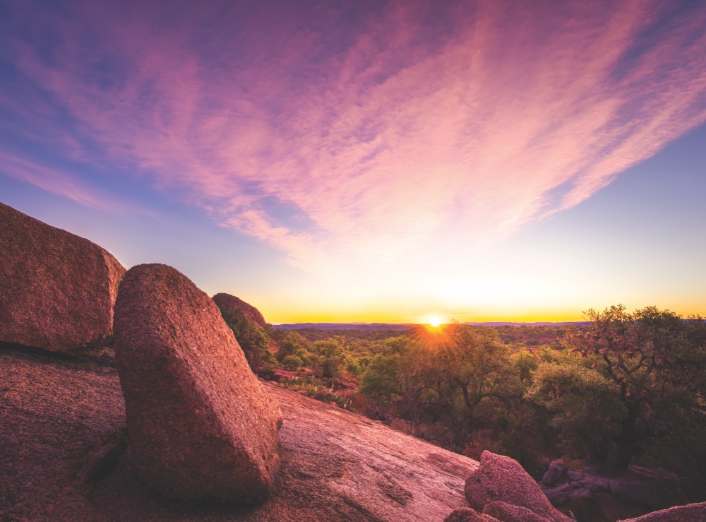 Image of sunrise at Enchanted Rock. June 23, 2023