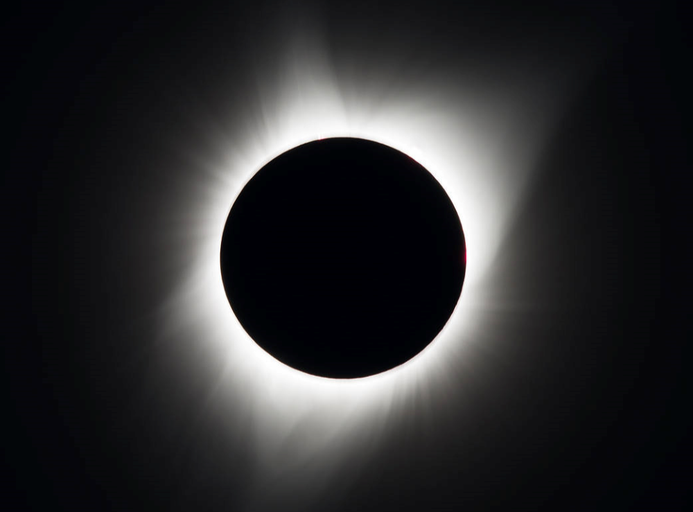 a total solar eclipse showing the sun's corona