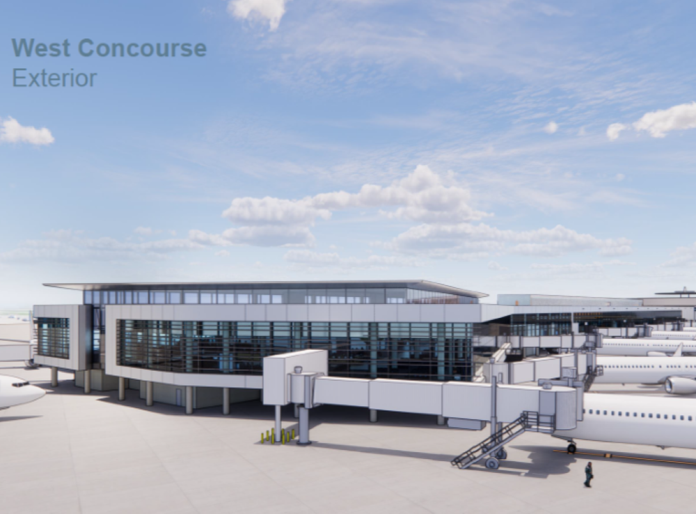 airport concourse with white details and a blue sky behind it in Houston