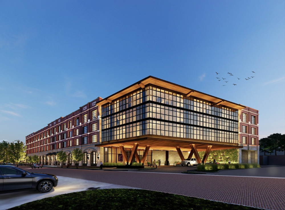 Bowie House Hotel in a historic building with new addition is surrounded by an evening sky.