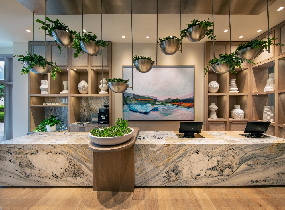 Lobby check-in counter at The Westin Sacramento Riverfront Hotel & Spa with plants and ceramics display. January 14, 2025