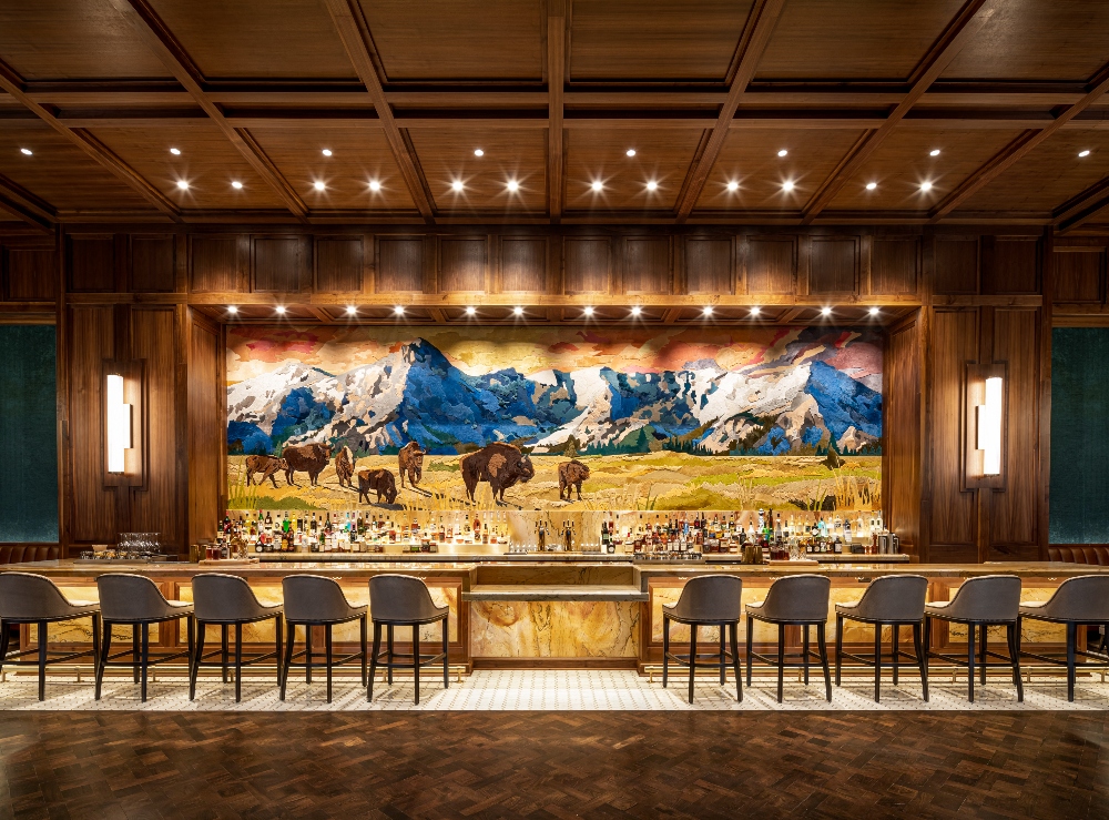 Colorful mural depicting bison and mountain peaks behind the bar at Old Hickory Steakhouse. February 7, 2025