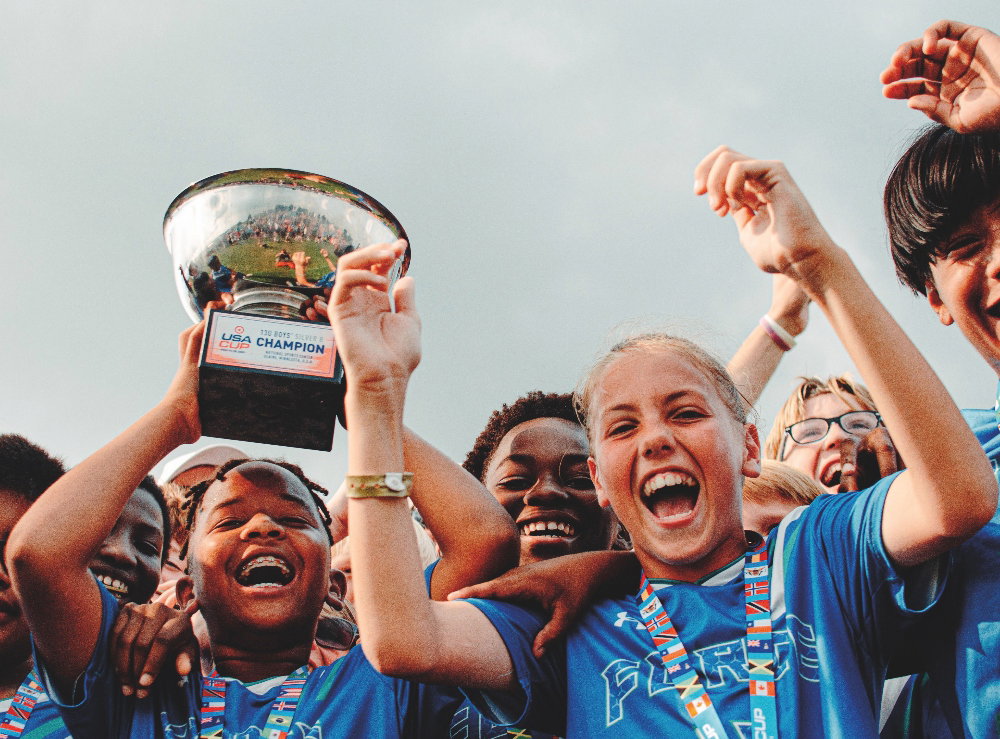 Youth athletes holding up at trophy at the 2024 Target USA Cup in Blaine, Minnesota. October 29, 2025