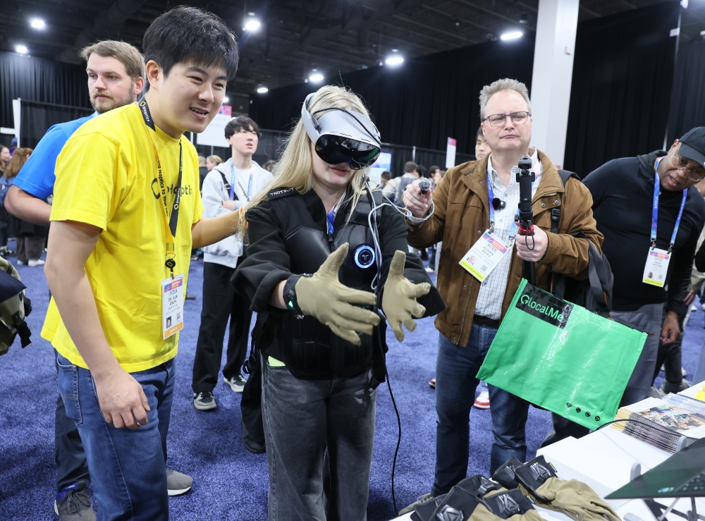 Attendee tests out virtual reality equipment at the 2026 Consumer Electronics Show Unveiled pre-event show