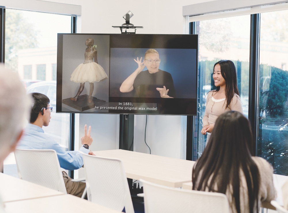 Video with closed captions and American Sign Language overlay