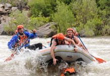 A Rafting Event That Brings Your Team Together Battle of the Bighorn racers working to rescue their watermelon