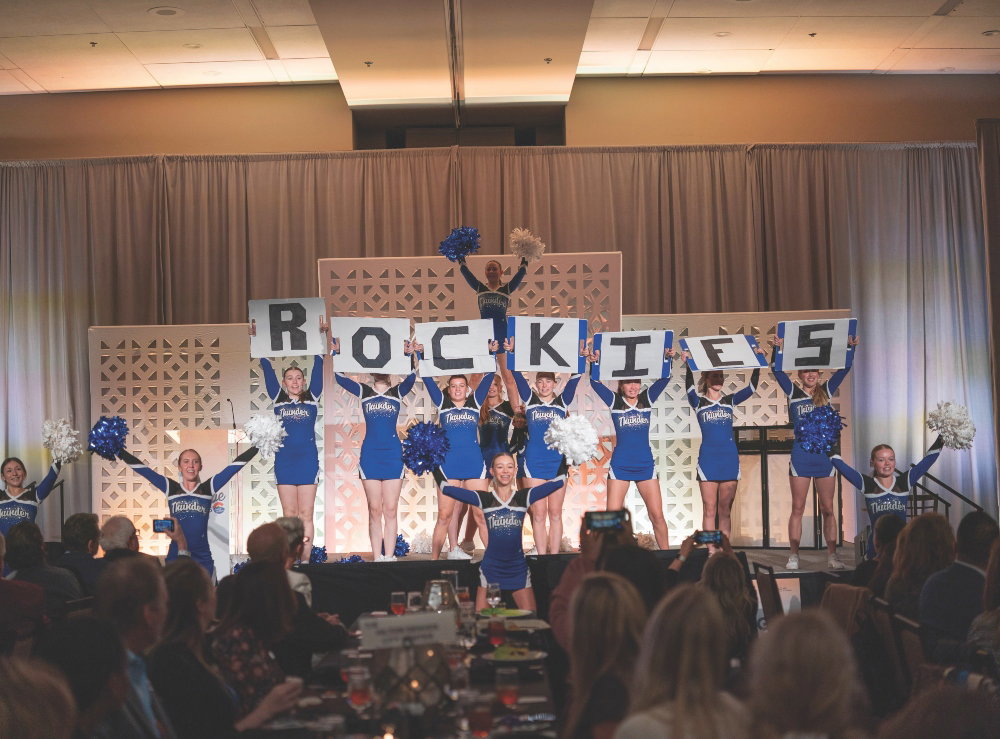 A 5 Star Talent and Entertainment cheer team performs at the Meetings Industry Council of Colorado’s Serving Up Hope luncheon.